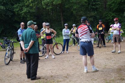 John gives instructions to the cyclists
